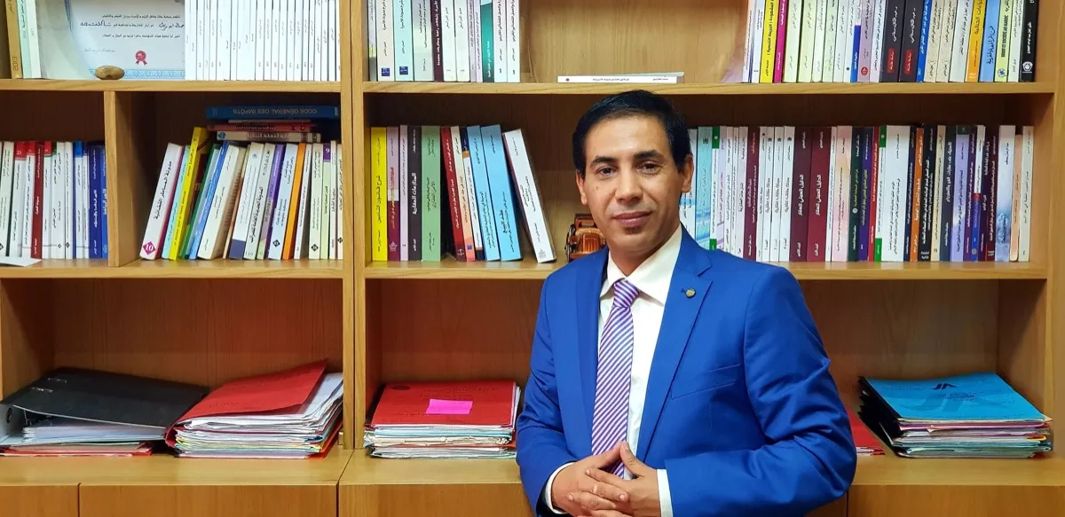 Chamlale Abdelhak Esq at his Casablanca law office with legal reference library
